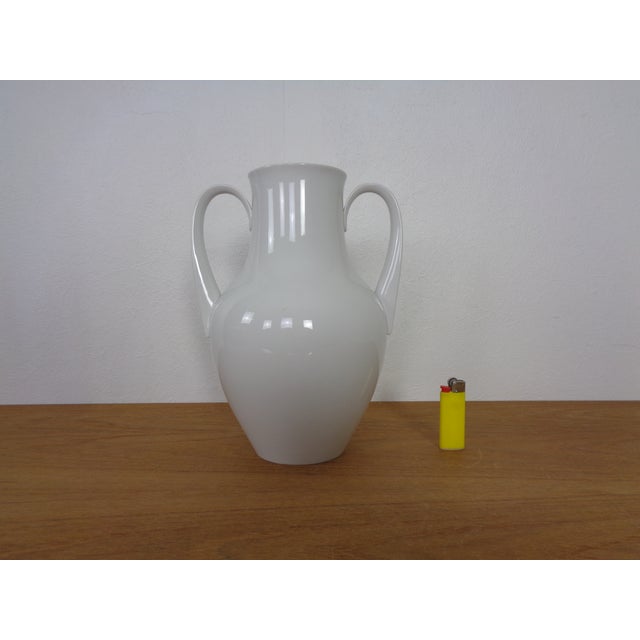 White porcelain vase with handles by Siegmund Schütz for KPM Berlin. Design from 1951. Marked on the underside. Very good...