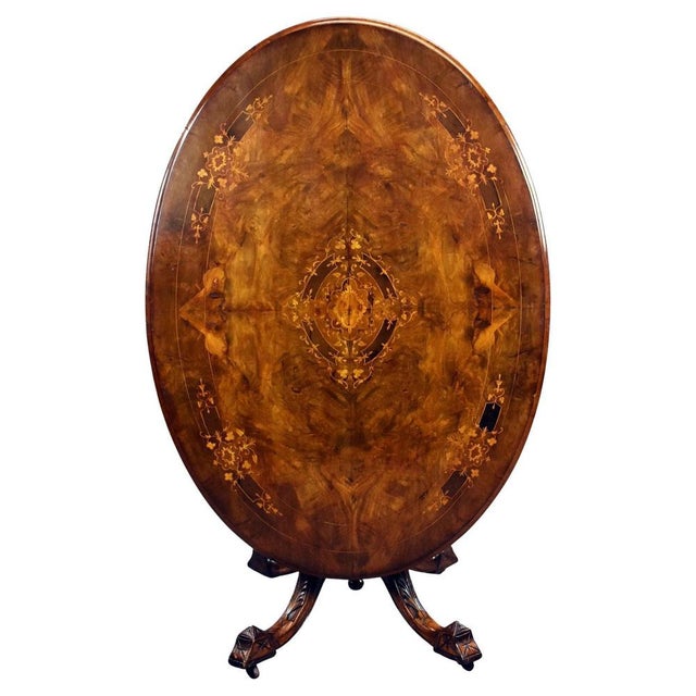 A superb Victorian burr walnut centre table, richly inlaid and beautifully figured, dating from the mid-19th century. The...