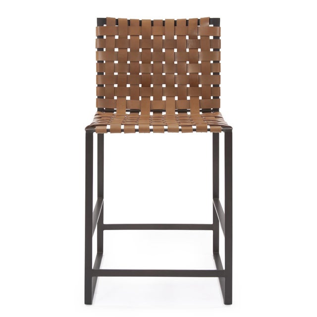 Mixing materials within a design adds a distinct level of interest to a piece. The Irving Counter Stool Chair is the...