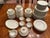 A refined vintage porcelain dinner service by Haviland & Co., Limoges France, in the classic “Albany” pattern featuring a...