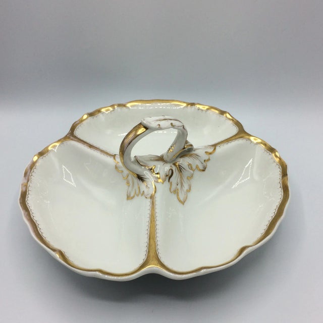Beautiful white with gold trim and scallop gold inset. Has three divides with an Acanthus leaf design in relief. Mark on...