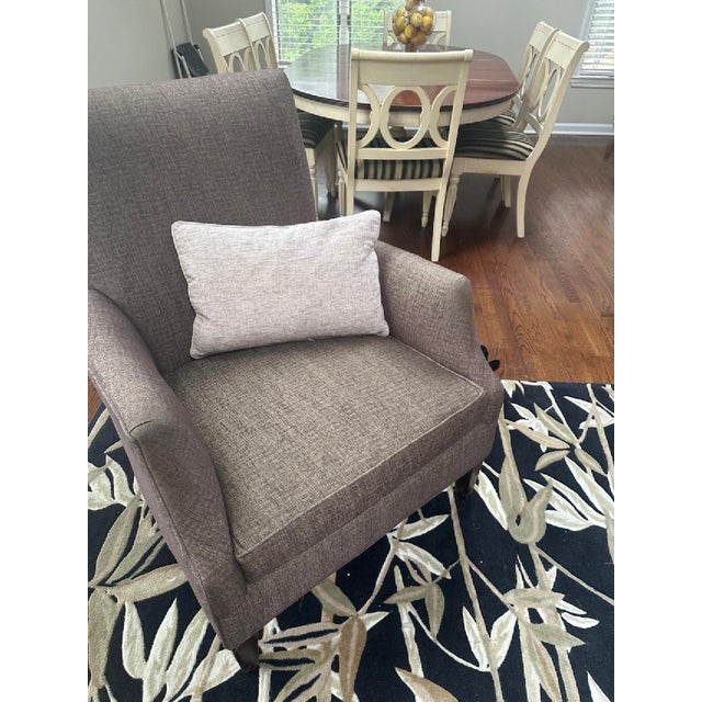 Handsome High-back accent chair by Arhaus, upholstered in a versatile warm taupe-brown textured fabric. The chair features...