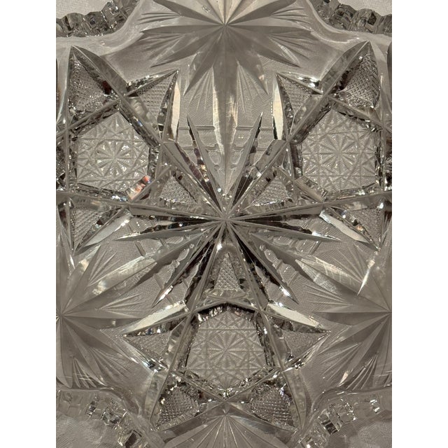 This candy dish/serving bowl is made from intricately hand cut crystal, characteristic of the American Brilliant Period....