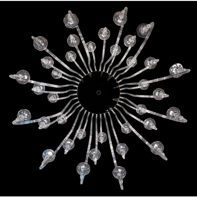 This chandelier has 24 arms. The edge and ferrule are in silver. Up to 250V (Europe/UK Standard).