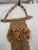 A striking vintage 1970s macramé owl wall hanging, handcrafted in natural fiber rope with intricate knotwork and mounted...