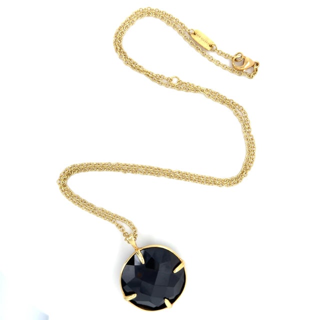 This stylish necklace by Italian designer Ippolita consists of a circular rose cut onyx measuring approximately 25.00 mm...