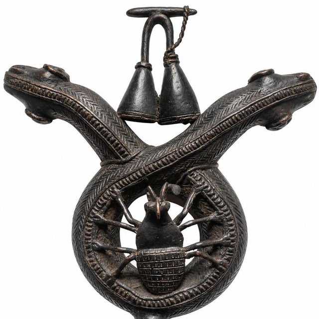 Royal Bamoun/Bamum insignia with a double-headed serpent, a spider-magal, and a double gong, symbols linked to the royal...