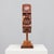 A captivating sculptural portrait by lawrence schneider, hand-carved from rich cherry wood. The work, titled “profile ii”,...