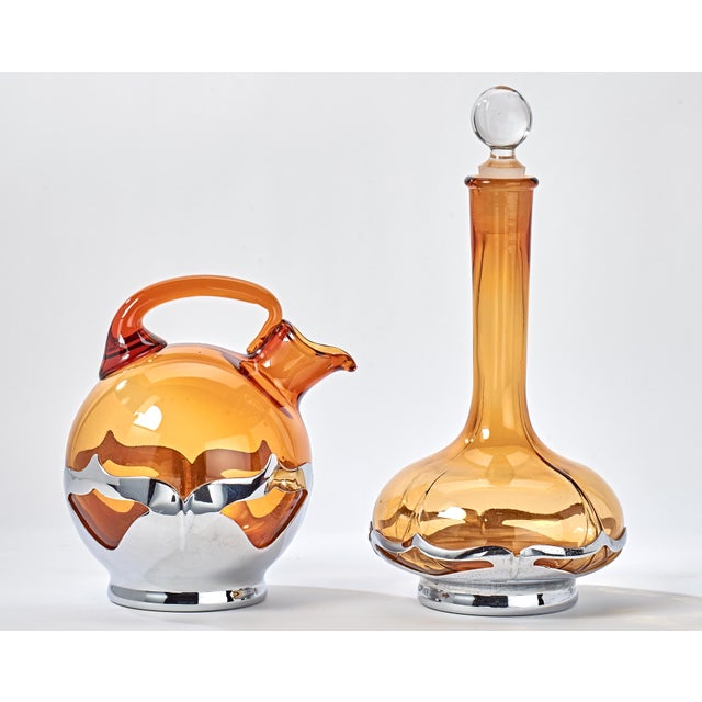 Beautiful chrome and glass decanters that add that vintage colorful touch to your bar or lounge.