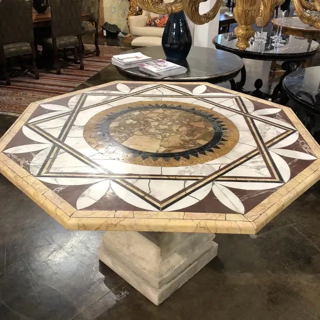 Italian marble top center table featuring a limestone base. Circa early 1800. Created in Italy.