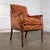 Magnificent vintage French Louis XVI Directoire style bergère chair composed of a petite walnut frame and upholstered in a...