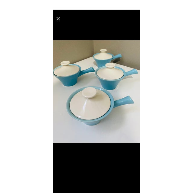 These vintage lidded bowls are identified as individual French casseroles from the "Scandia" line produced by Cameron Clay...