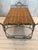 Vintage scrolled style wrought iron verdigris finish and woven rattan bed table.