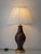 A sculptural mid-century ceramic table lamp from Manises, Valencia, finished in a rich chocolate-brown glaze and newly...