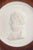 Meissen Biscuit plaque, c. 1970s. Circular relief plaque in white biscuit porcelain with a classical profile portrait and...
