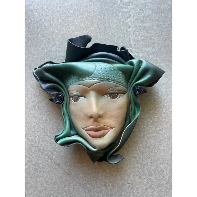 90s sculptured and tooled leather face from noted sculptor Doug Gibson. Original condition with no cracking, paint loss to...