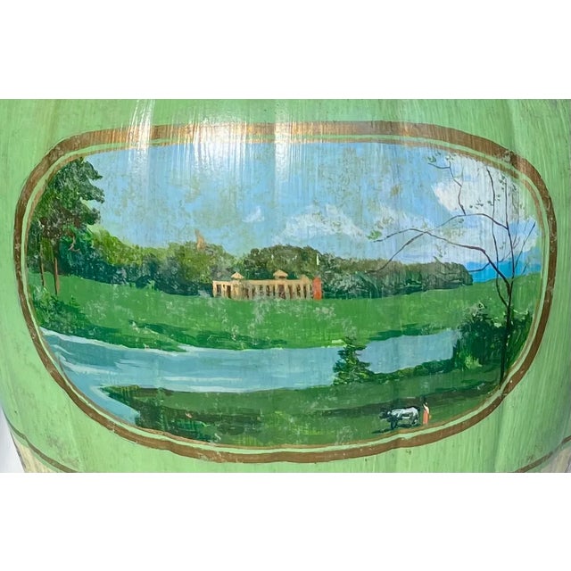 Hand-painted celadon ceramic lamp with neoclassical landscapes and silk pleated shade. Elegant and timeless. A striking...