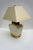 Glam Hollywood Regency Chapman Pagoda table lamp. Cream and brass base and trapezoid shaped original shade with gold...