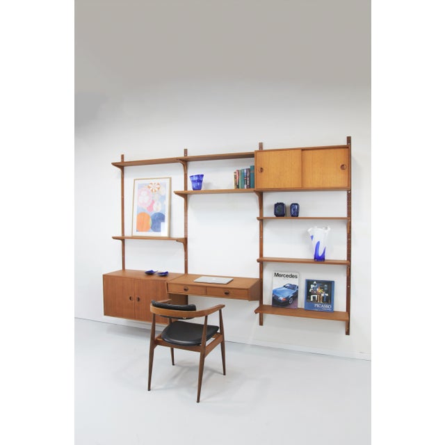 A beautiful 3-tier shelving system from HG Furniture of Denmark. This versatile set impresses with its balanced design and...