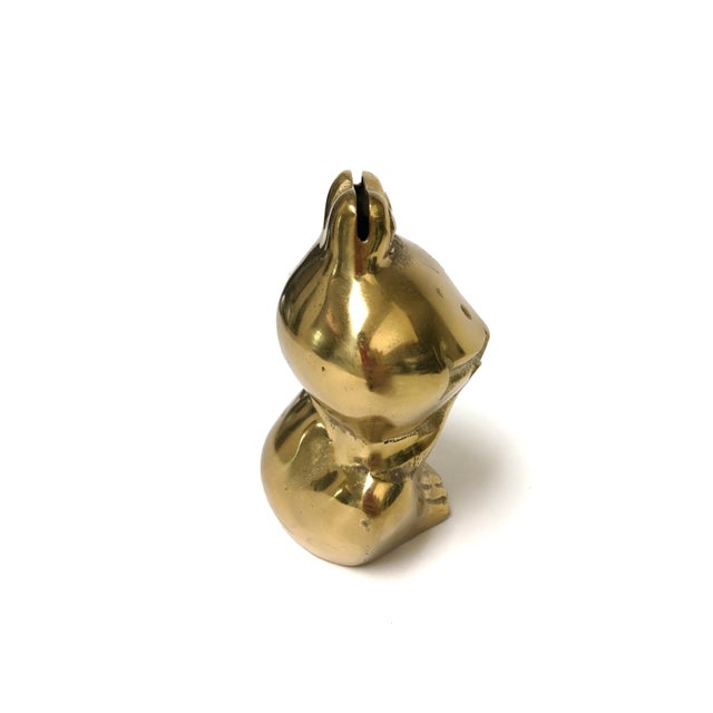 This charming small brass frog bank is the perfect addition to any home or office. Its cheerful grin and intricate details...
