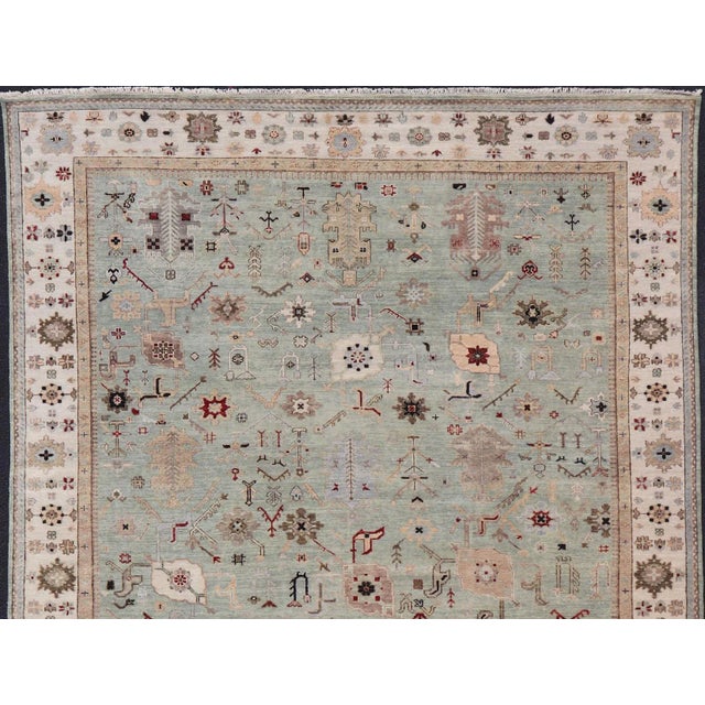Hand-Knotted Wool Oushak Rug in Turquoise Green and Multi Colors 10' x 13'6 Measures 10' x 13'6 Type: Oushak; Design: All-...
