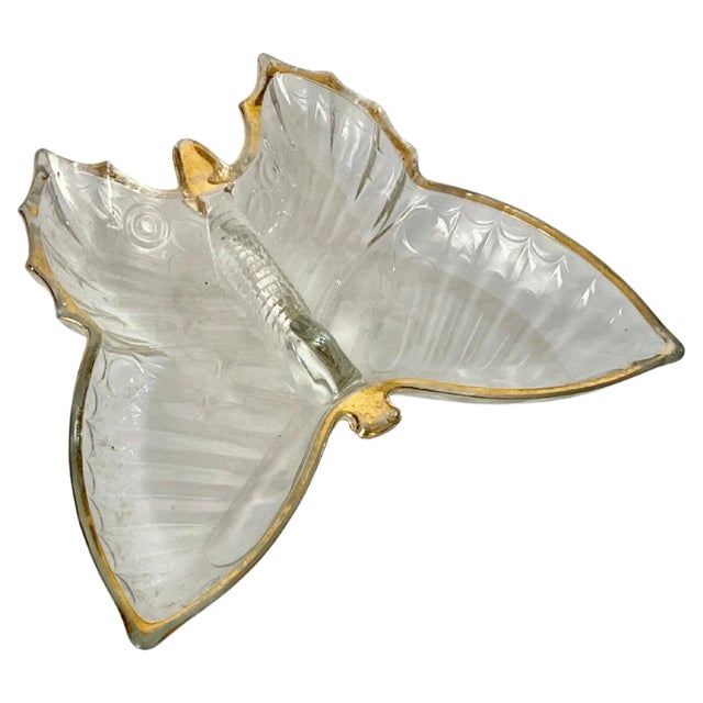 It is a glass ashtray, in the shape of a butterfly. It was made in France in the 80s. It has a gold edging that runs...
