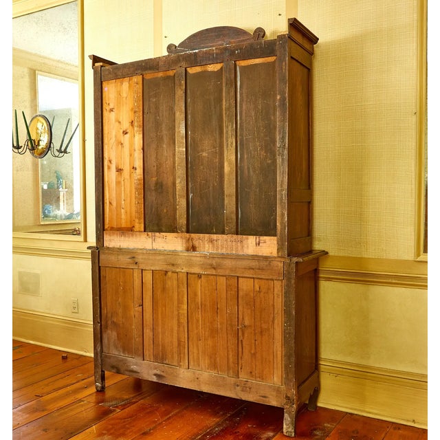 An impressive 18th-century French Provincial buffet à deux corps, crafted in solid oak during the Louis XV period, circa...