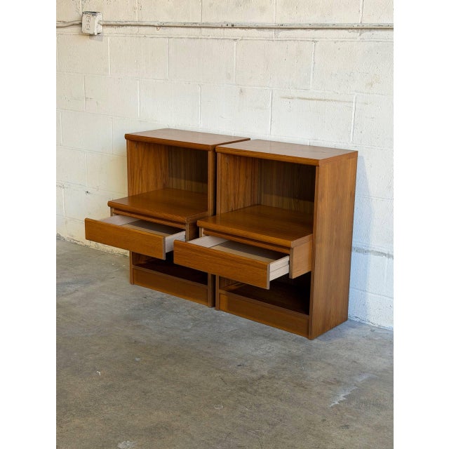 This handsome pair of nightstands features clean architectural lines and functional open shelving. The streamlined...