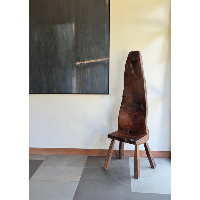 A remarkable antique stool from Java, Indonesia, distinguished by its primitive sculptural form and commanding silhouette...