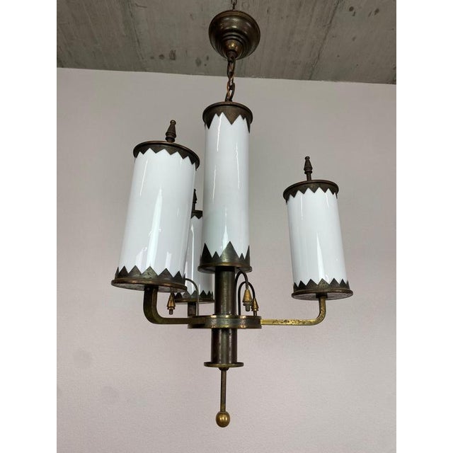 Rondocubist art deco brass hanging lamp with white glass lampshades. Up to 250V (Europe/UK Standard).The wiring of this...