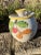 A charming vintage Italian hand-painted ceramic biscotti jar by DBR (marked "Italy DBR" on base), featuring delightful...