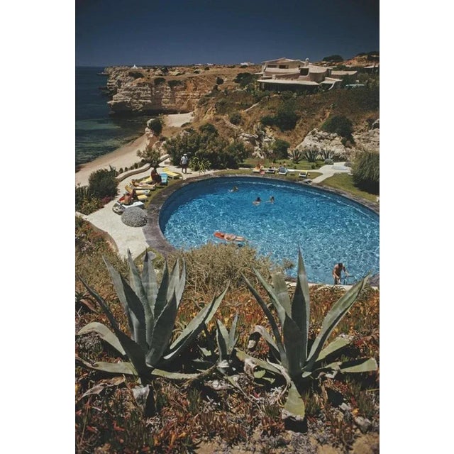 Algarve Hotel Pool 1970 by Slim Aarons Slim Aarons Limited Estate Edition Guests in the pool at the Algarve Hotel, the...