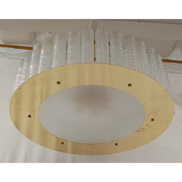 Fantastic round chandelier in Murano glass and polished brass. Note the shape of the glass glasses it is made of. Murano...