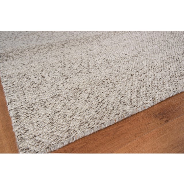 The Rhodes collection is a flatweave construction made of yarn dyed PET fibers. The subtle tweed appearance of the...