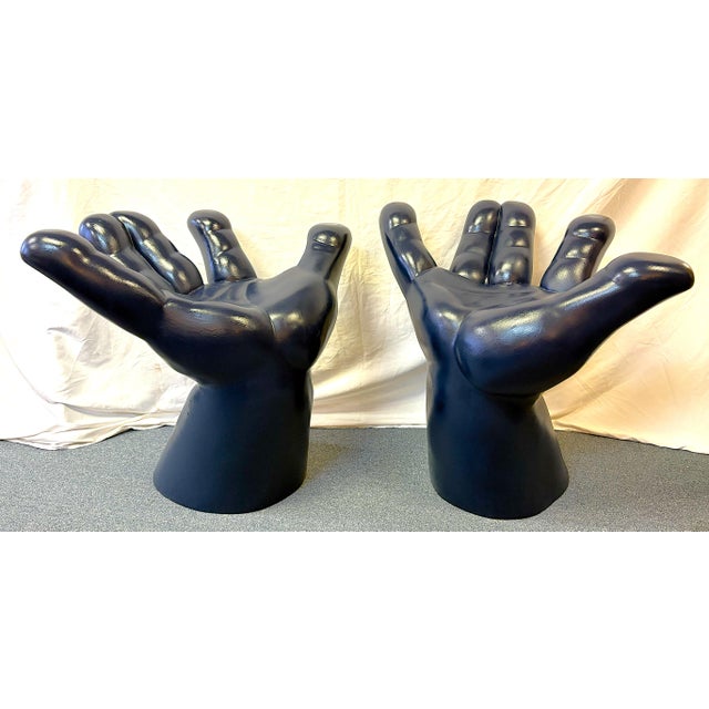 Groovy pair of mid-century modern retro hand chairs from the latter 20th century. They are made of molded plastic...