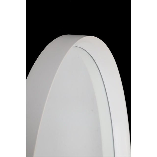 Large oval wall mirror from the 1960s/1970s. West Germany. Frame made of heavy fiberglass-reinforced plastic with a high-...
