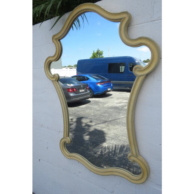 This classic Mirror is made out of wood, and mirror. This Mirror has a beautiful French style design, carved serpentine...
