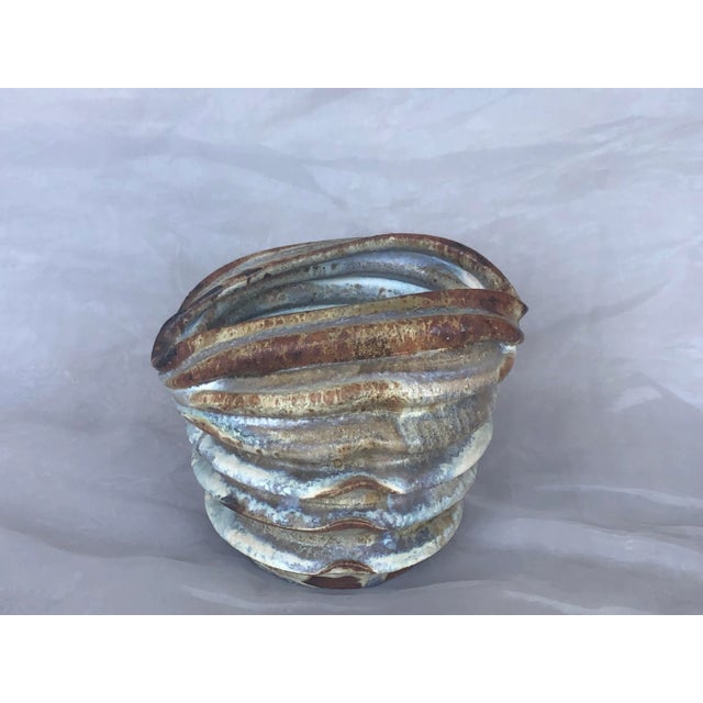 With its unusual pleated shape, this vintage modern art pottery vase will make a dramatic home decor accent on a table or...