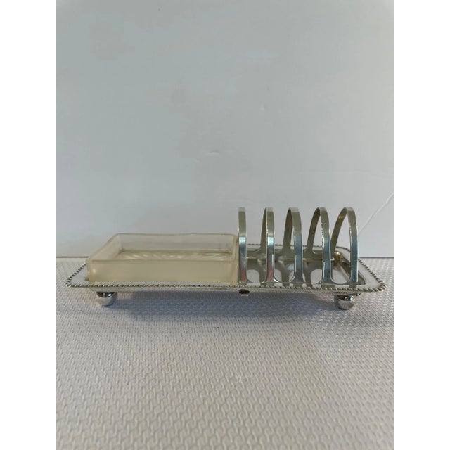 A gorgeous English De Montfort Silverplated Traditional Toast Rack with a frosted glass dish for serving butter or jam....