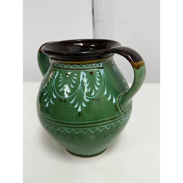 Design Plus Gallery presents a Vintage Signed Hungarian Folk Art Double-Handled Pottery Vessel. This glazed ceramic vessel...