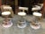 Bring the Old Hollywood Glamour to your space with these Art Deco swivel gold counter chairs upholstered with white...