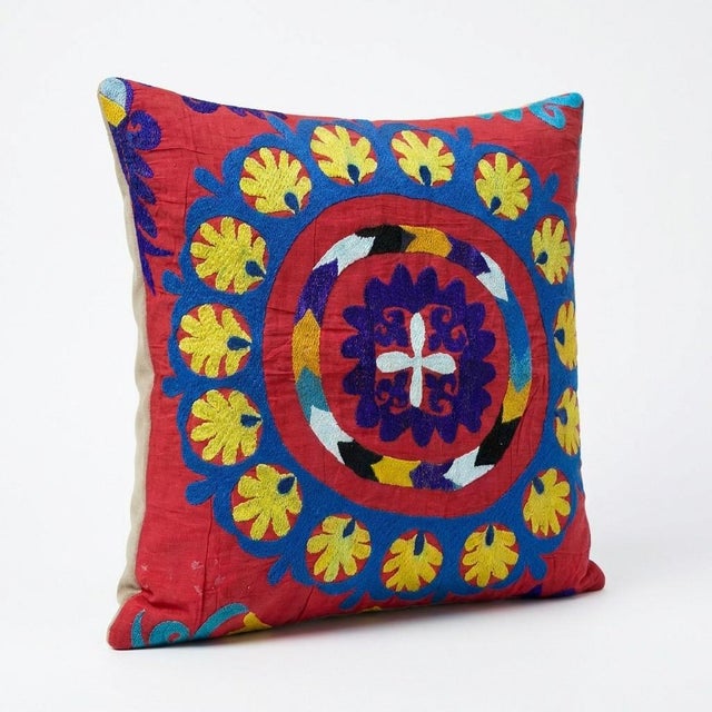 This beautiful 19'' x 21'' hand-embroidered Suzani pillow cover was made from authentic Uzbek cotton fabric. The intricate...