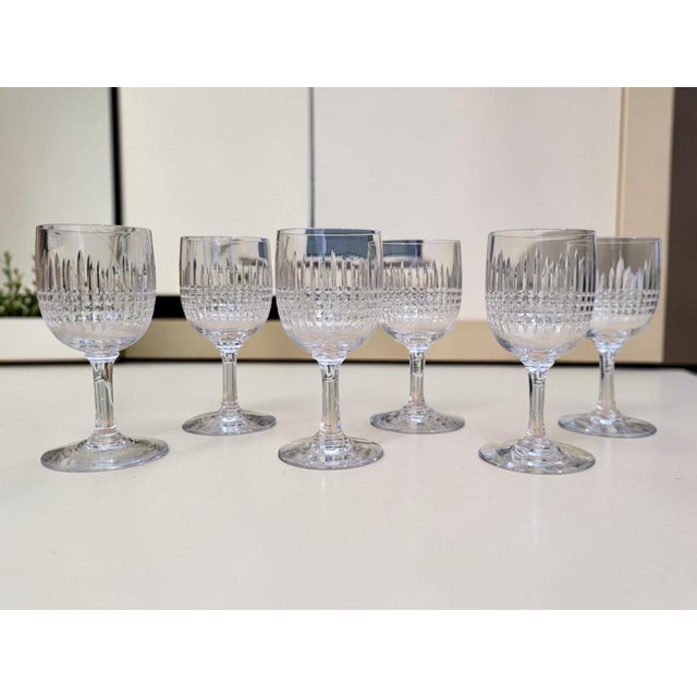 Six cut crystal port glasses from the renowned Baccarat crystalworks, in the Nancy pattern. Created in 1867, this iconic...