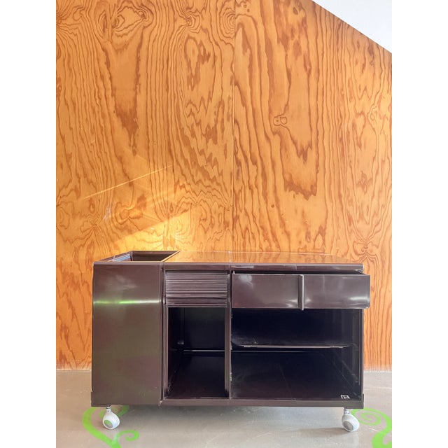 We are thrilled to present you an authentic labeled cabinet dating back to the 1970s, made of brown plastic by Elco, a...