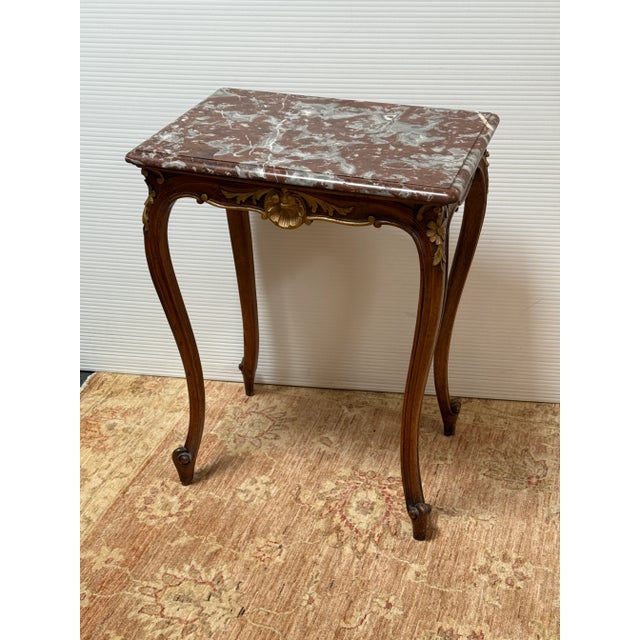 Design Plus Gallery presents an Antique French Accent Table. Theatrical for a small piece the Louis XV style accent table...
