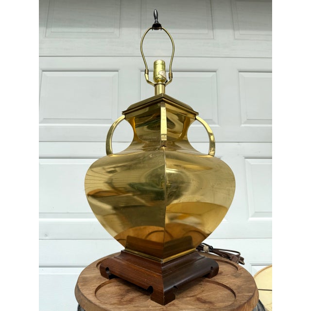 Add a touch of timeless warmth and regal sophistication to your home with this beautiful vintage brass urn table lamp....