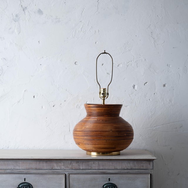 A pencil reed coiled table lamp in the manner of Crespi, 1970s. 14 ¾ inches wide 25 inches tall; 12 inches to top of reeds