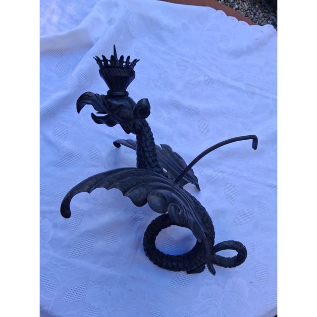 An absolutely rare piece, a wall candlestick in the shape of a dragon. The body is very finely carved from wood, while the...