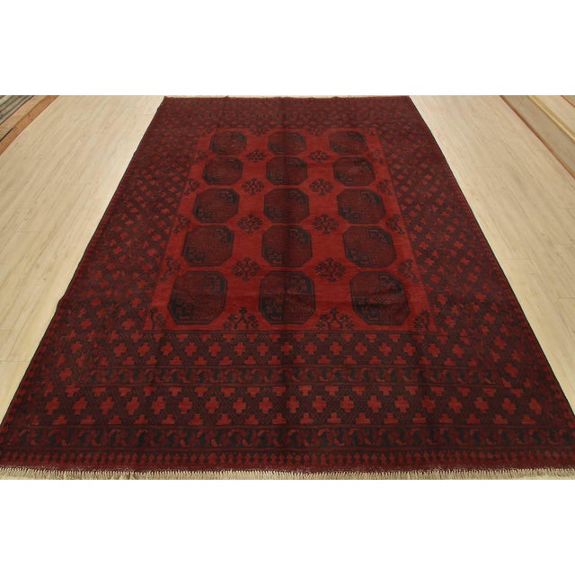 An authentic vintage tribal Turkmen rug hand-knotted with fine wool and natural dyes. This nomadic oriental rug features...