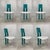 Gorgeous set of 6 dining chairs in turquoise with white bouclé upholstery on metal wire frames. This set in in a good...